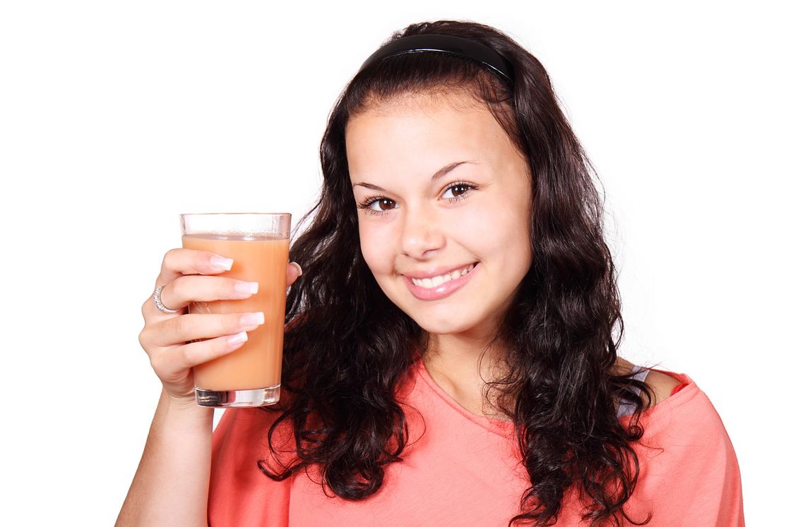 Woman holding a drink in her hand