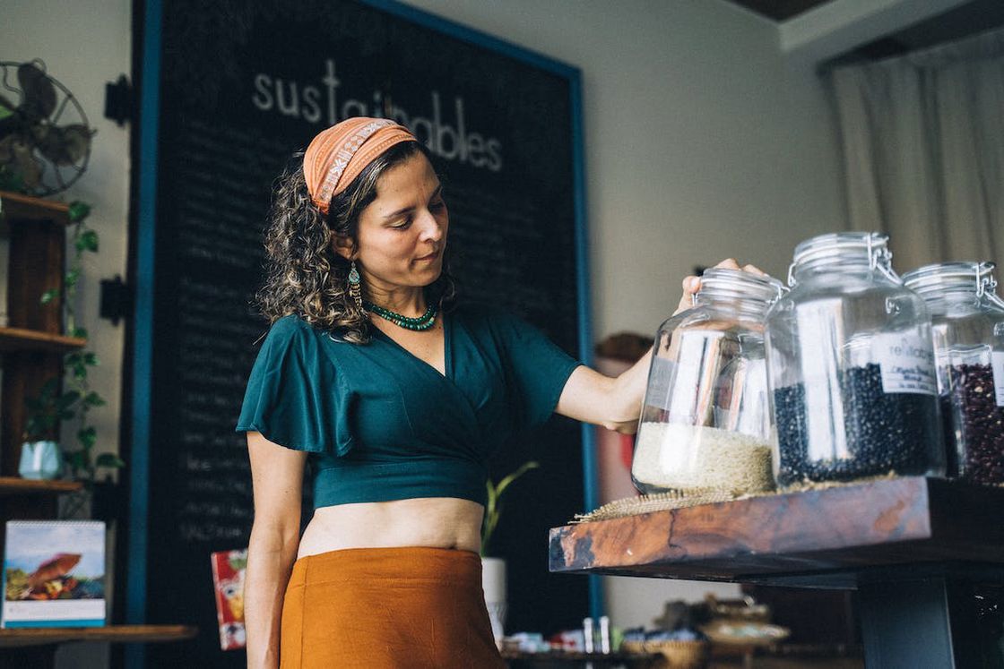 Woman checking the contents of her glass storage containers