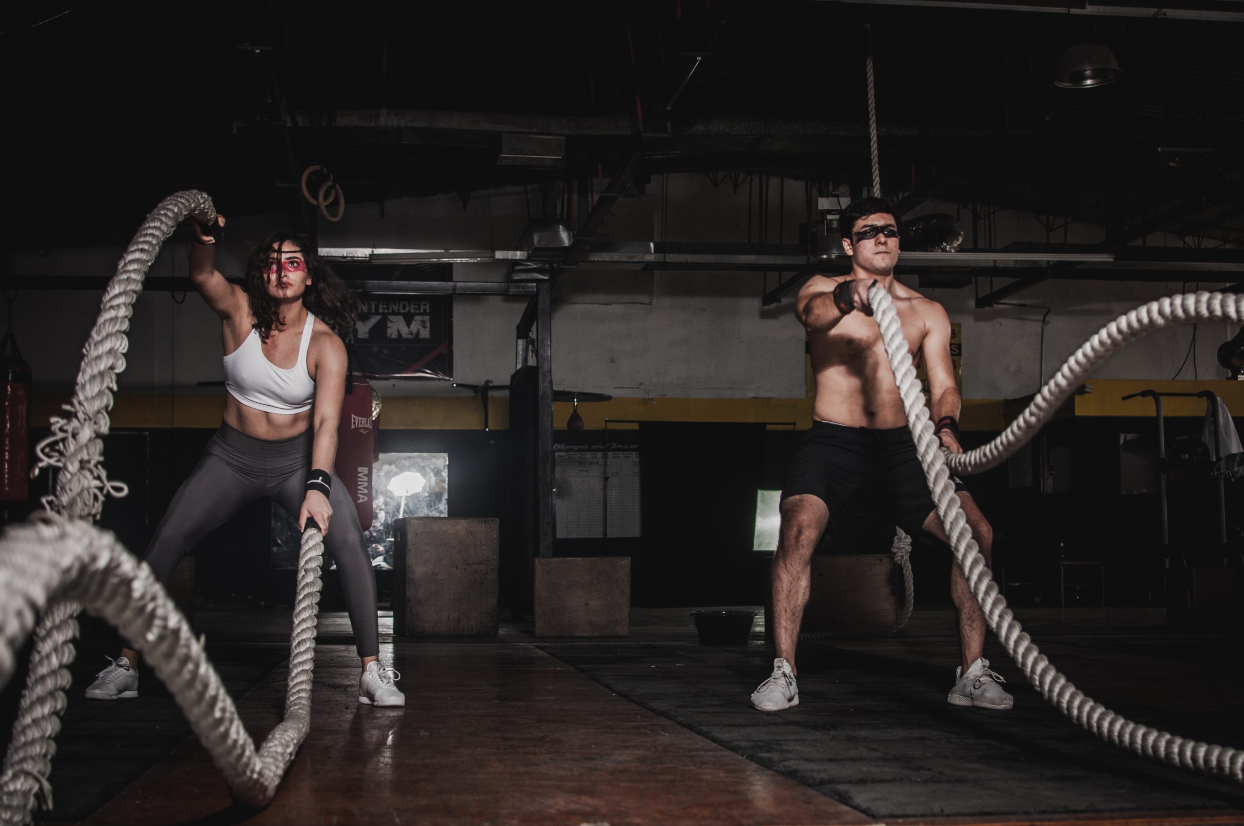 A woman and a man doing rope exercises