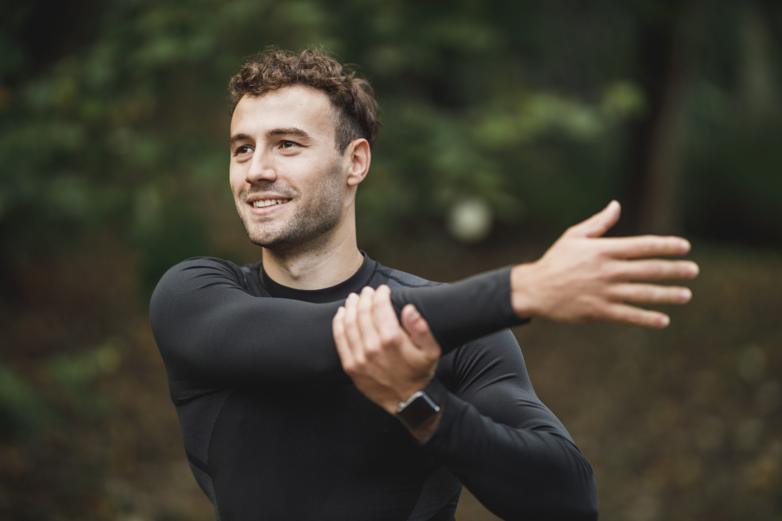 A man stretching his arms