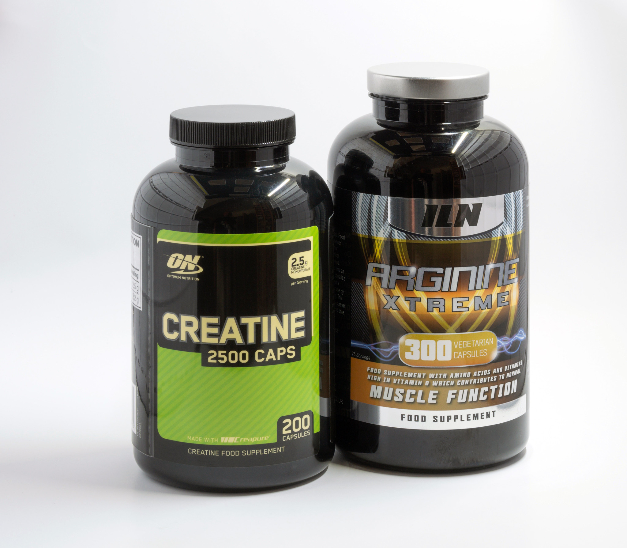 Bottles of creatine and arginine extreme